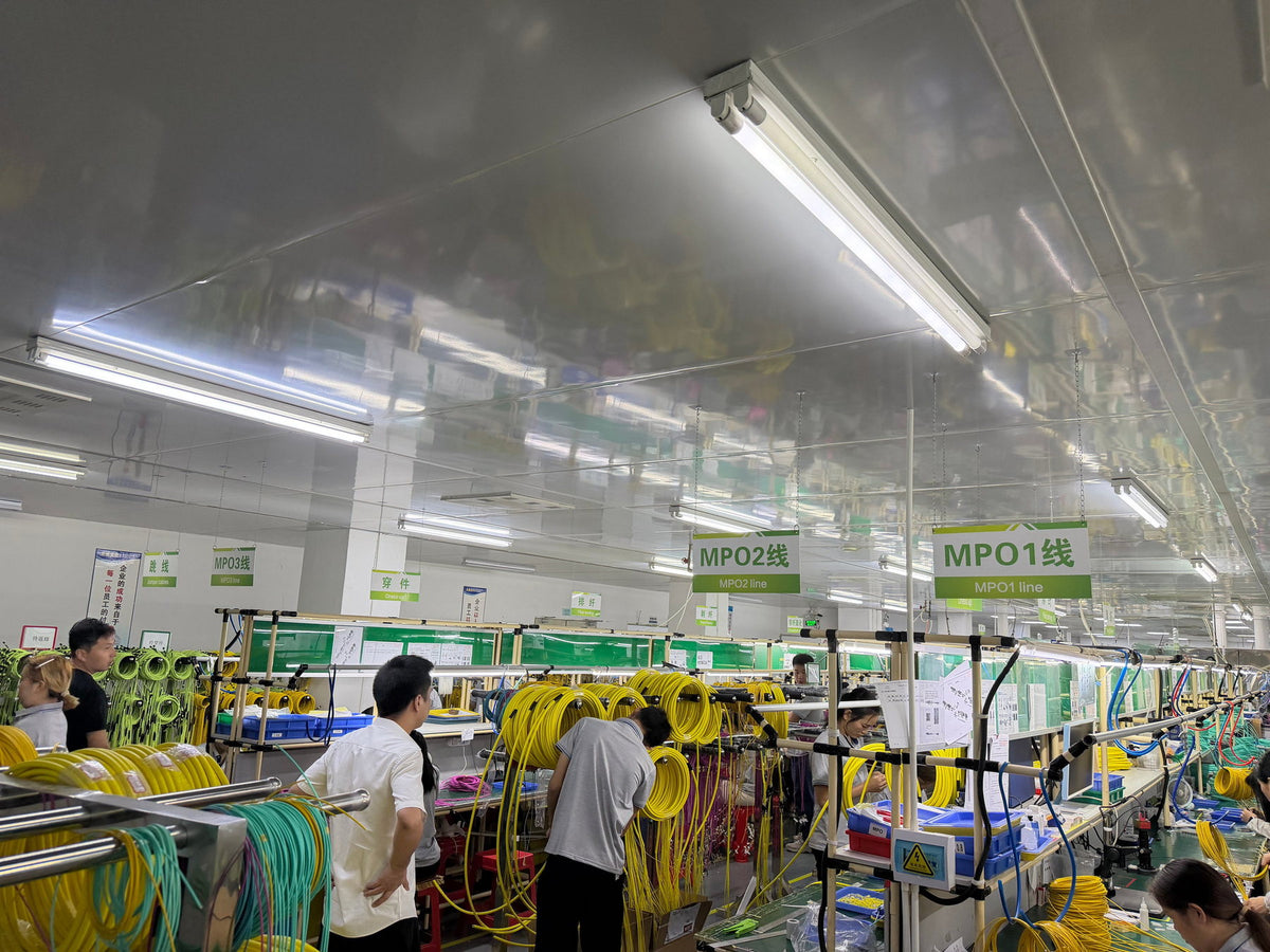Wide view of fiber cable assembly production lines and workstations